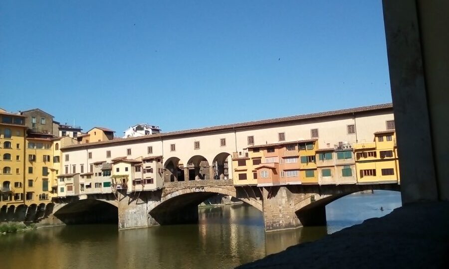 Florence: LGBTQ Renaissance Walking Tour with Mila - Crossing Santa Trinita Bridge toward Medici territory