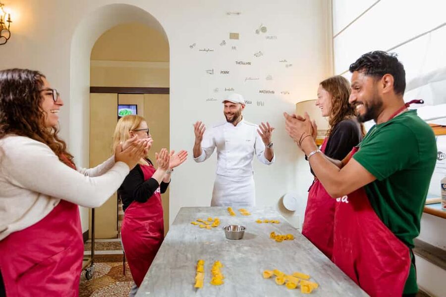 Florence: Pasta Class with Wine, Limoncello and Dessert - Ravioli, tortelli, and fettuccine on one worktable