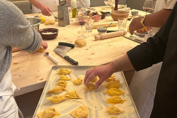 Florence: Pasta Cooking Class with Unlimited Wine - Cooking pasta inside a medieval tower