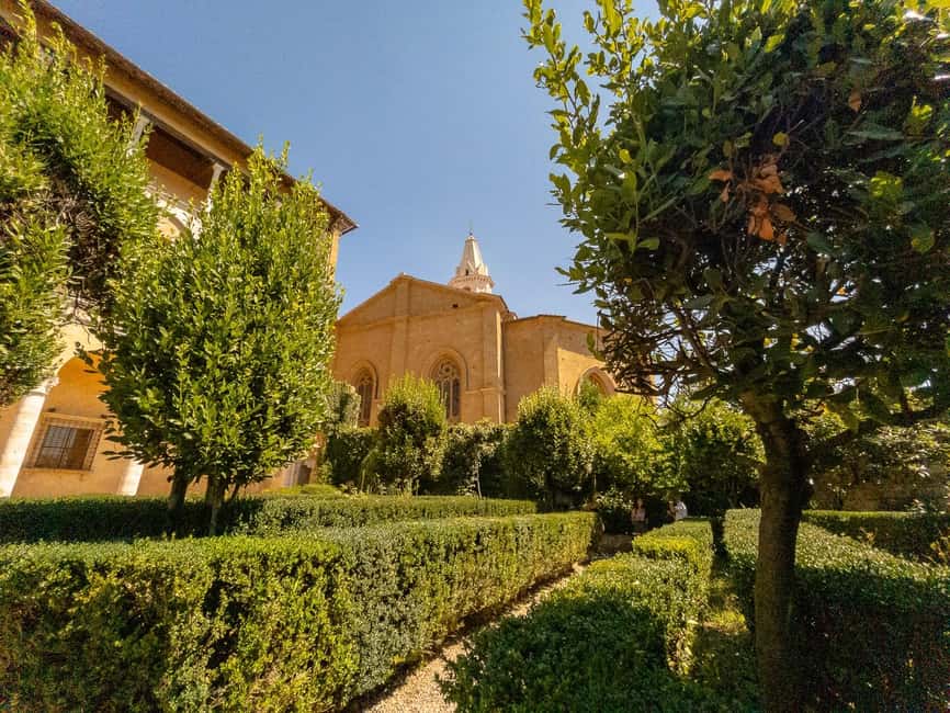 From Florence: Val D'Orcia Tour with Wine Tasting - Montepulciano, steep streets, and cellar walls