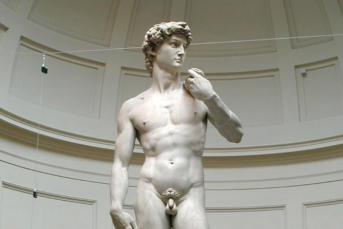 Private Skip-the-Line Florence Highlights and David Walking Tour - Walking across Ponte Vecchio and along the Arno