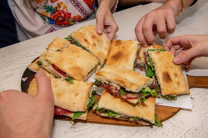 Taste the Flavours of Florence: Private Tuscan Food Tour - Crossing Florence toward Santa Croce