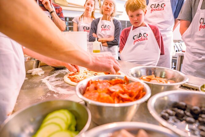 The Italian Way: Pizza and Gelato Class with Unlimited Wine - Choosing toppings and using the pizza oven